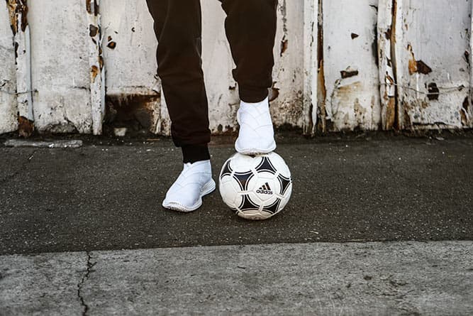 jacob wearing adidas sweatpants and using an adidas soccer ball