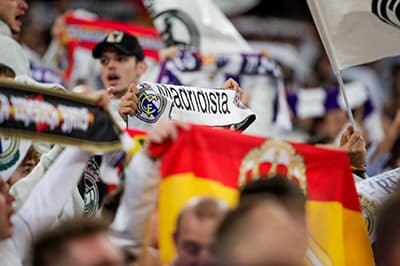 Madrid supporters often wave the national flag of Spain at matches to show support