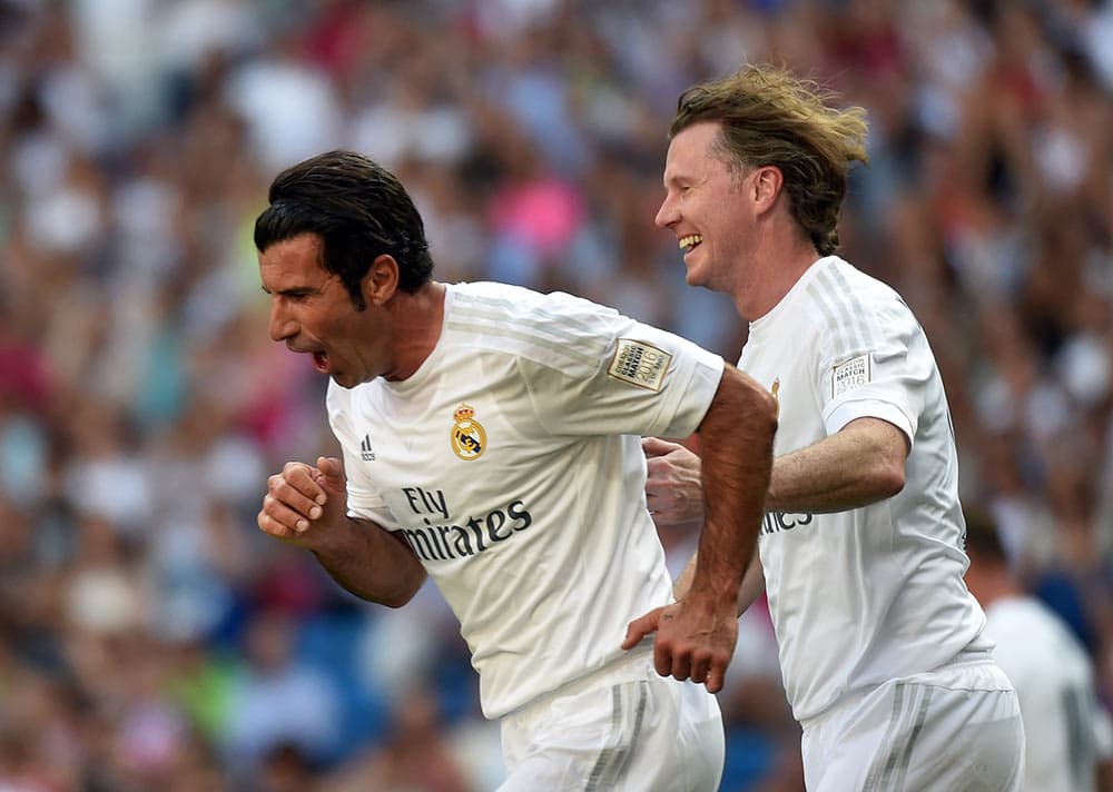 Luis Figo celebrates scoring for Real Madrid
